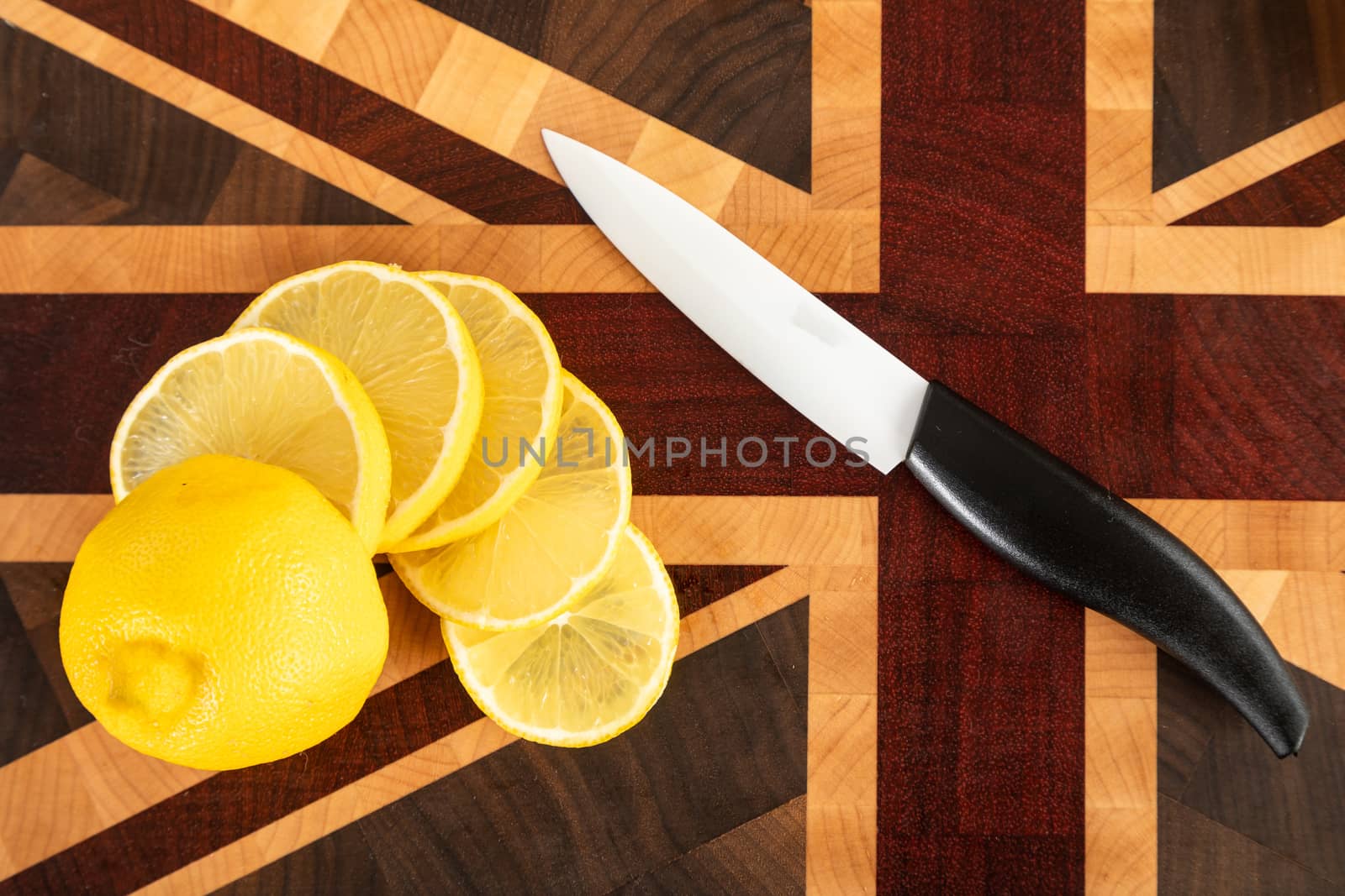 Still life with fruit. Sliced orange and other fruits on a wooden cutting board