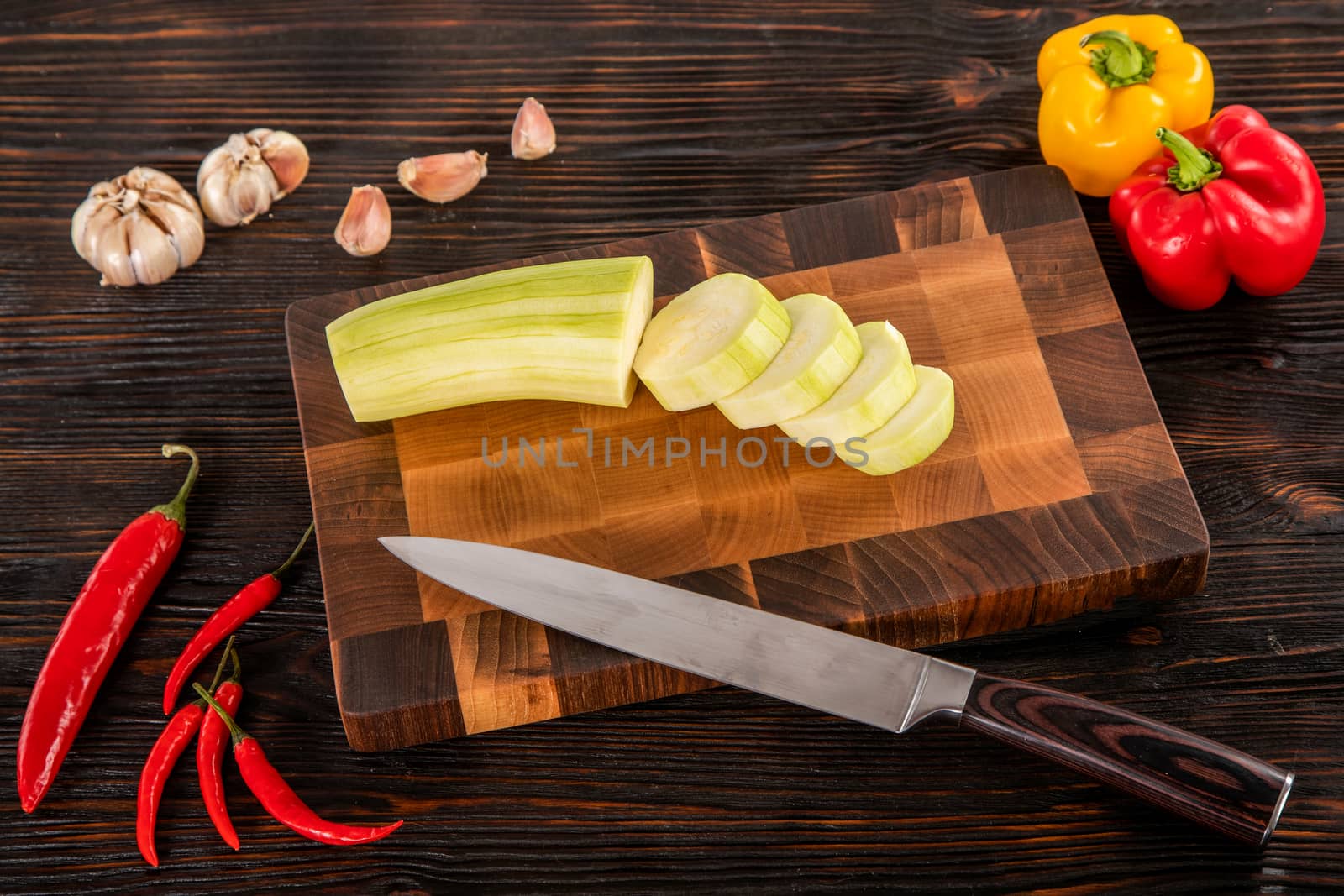 vegetables and spices on a wooden cutting board by sveter