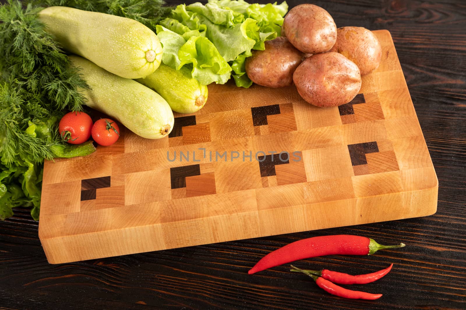 vegetables and spices on a cutting board by sveter