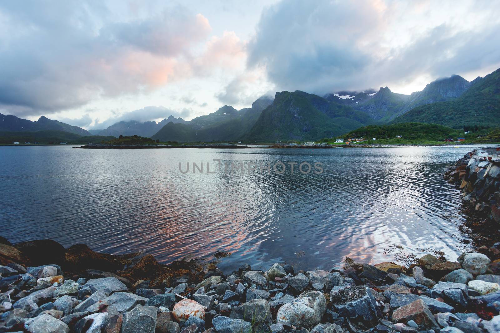 Beautiful sunset scandinavian landscape with village, mountains and fjords. Lofoten islands, Norway.