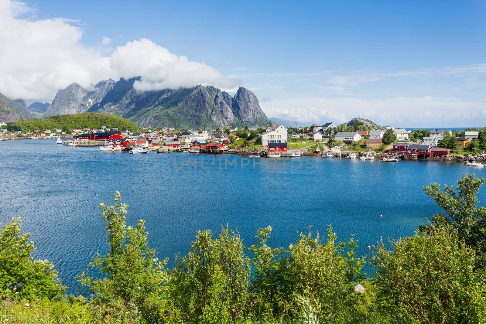 Beautiful scandinavian landscape with mountains and fjords. Panorama view of Reine village on Lofoten islands, Norway.