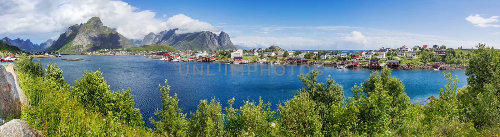 Beautiful scandinavian landscape with mountains and fjords. Panorama view of Reine village on Lofoten islands, Norway. by aksenovko