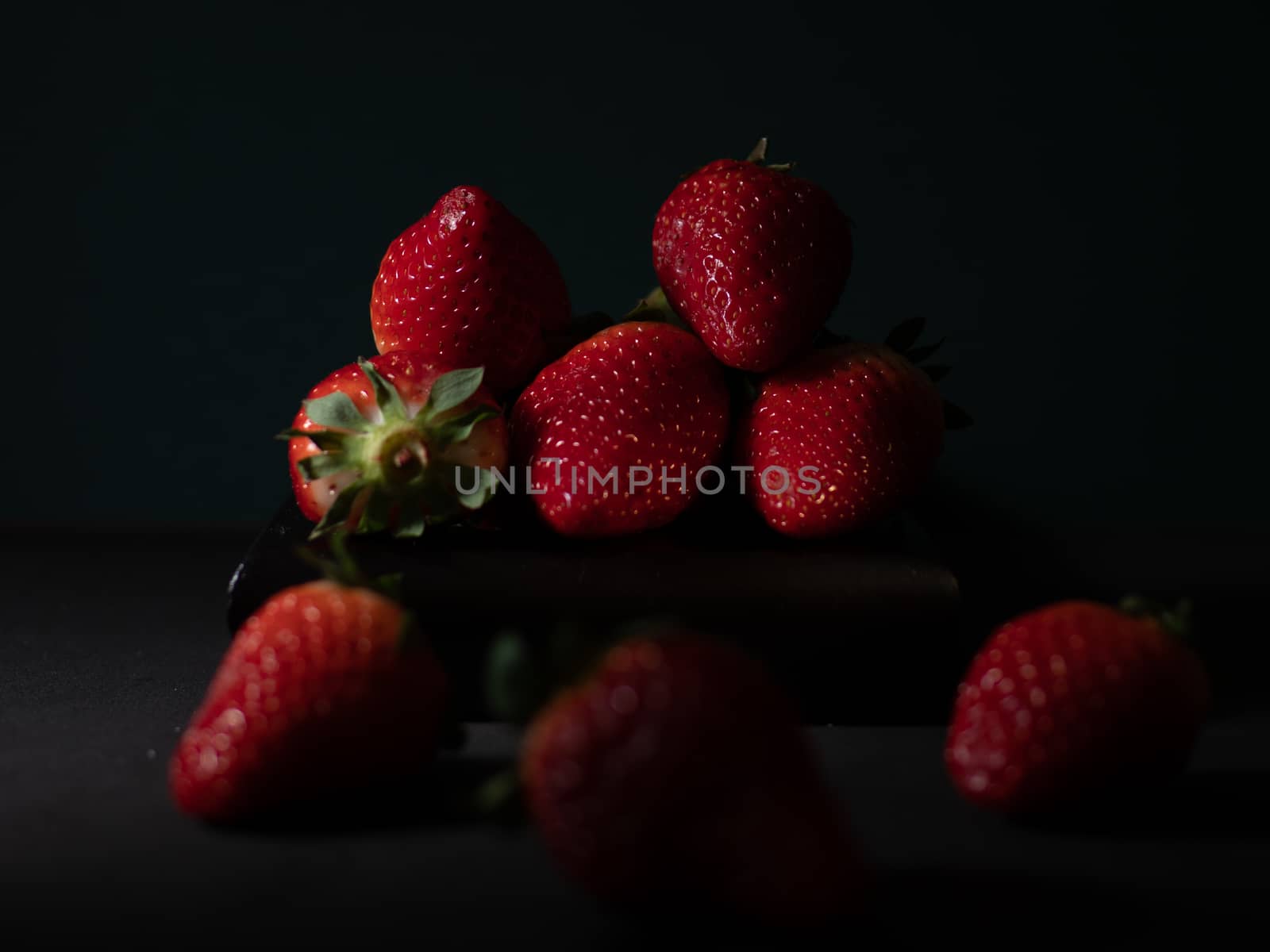 fresh strawberries on dark background