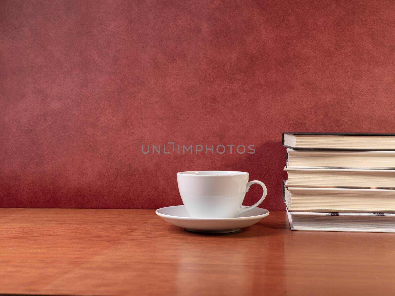 glasses and books on wooden table