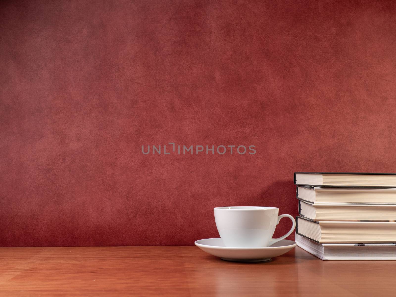 glasses and books on wooden table