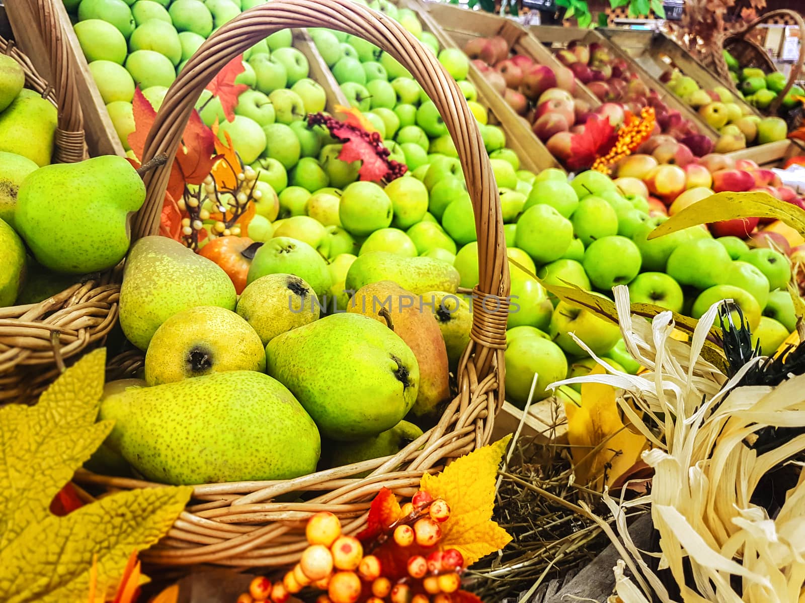 Concept of rustic sale stand with autumn fruit harvest at the market place or in the farmhouse.