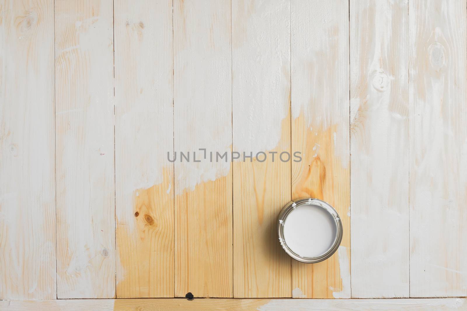 open cans of paint on a wooden background