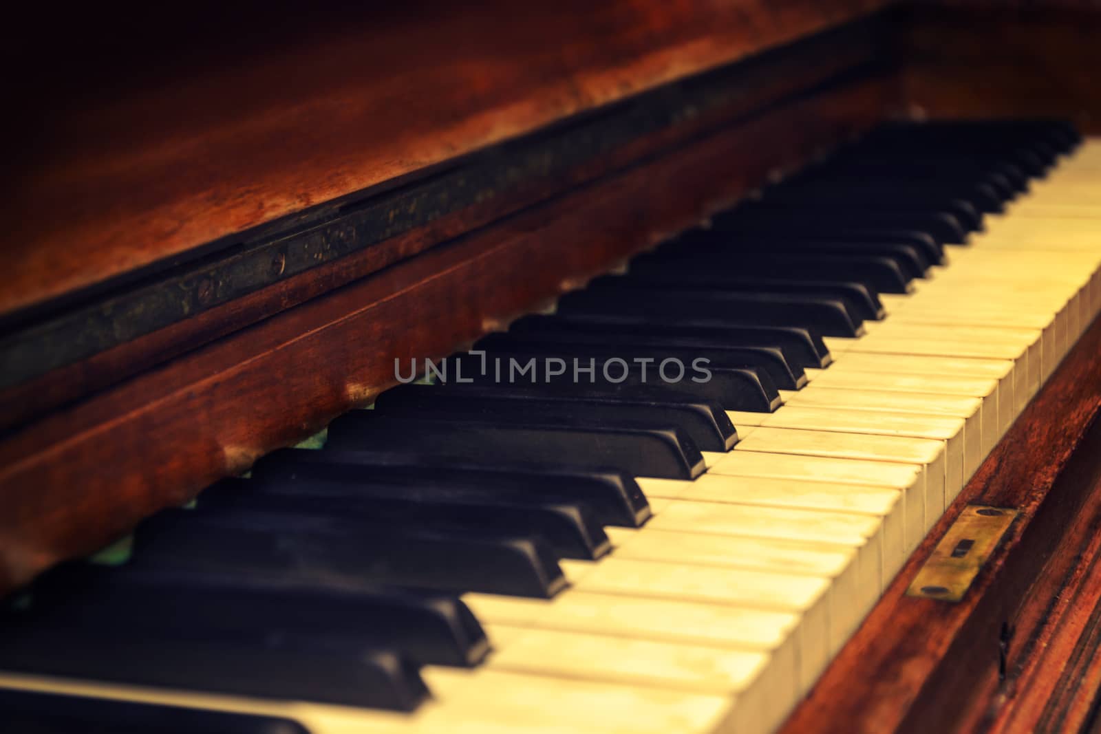 Closeup of a keyboard in an old vintage piano (very low DOF)