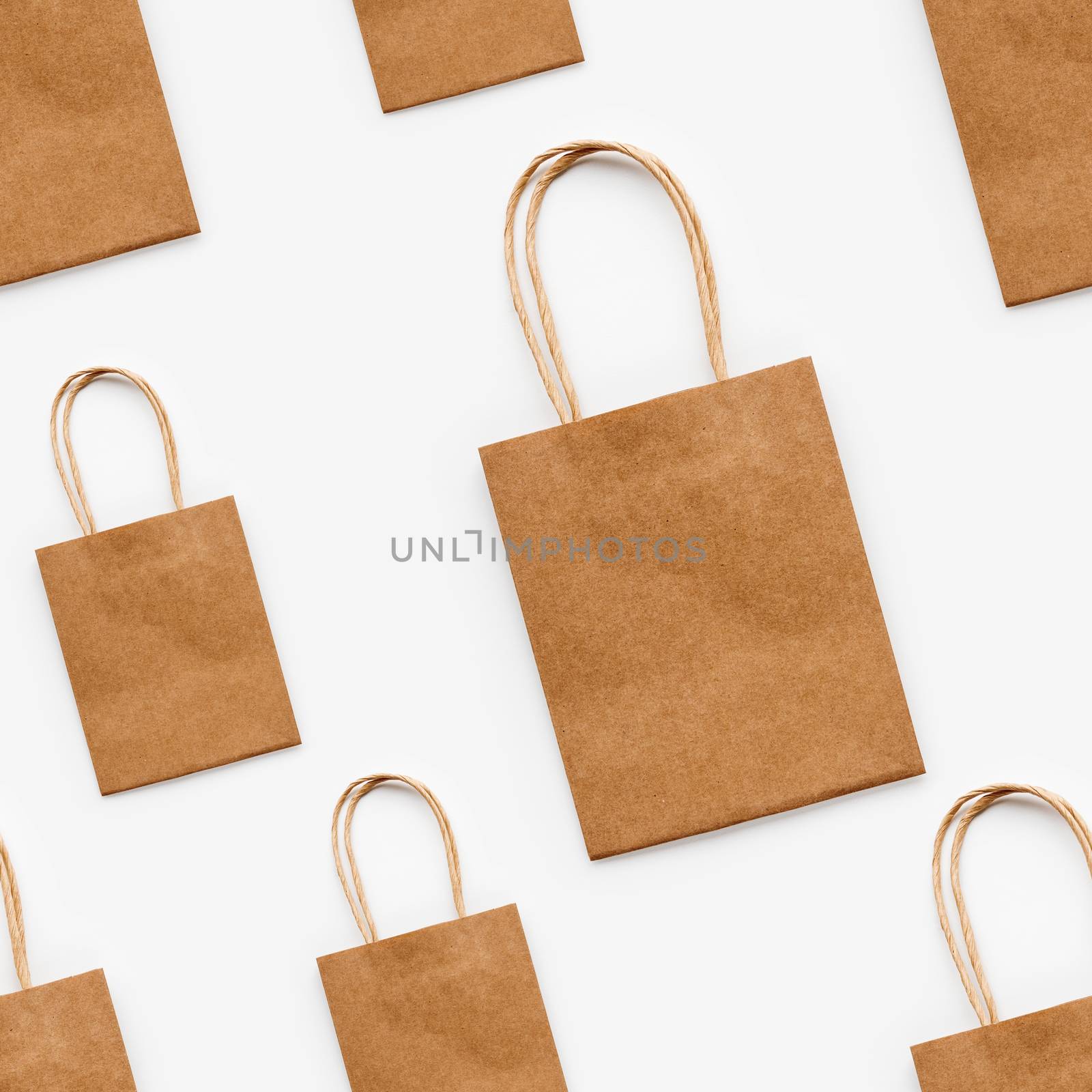 Photo seamless pattern with craft paper shopping bags. Zero waste lifestyle. Copy space. by aksenovko