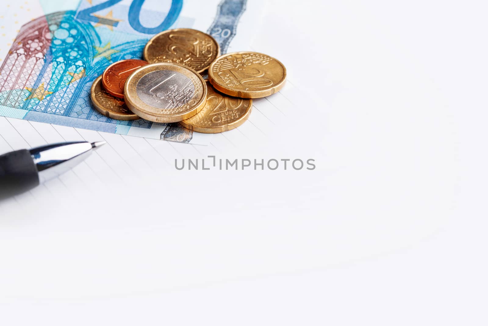 Euro coins and banknotes. European money, official currency of 19 of 28 member states of the European Union. Organizer and pen. Copy space.