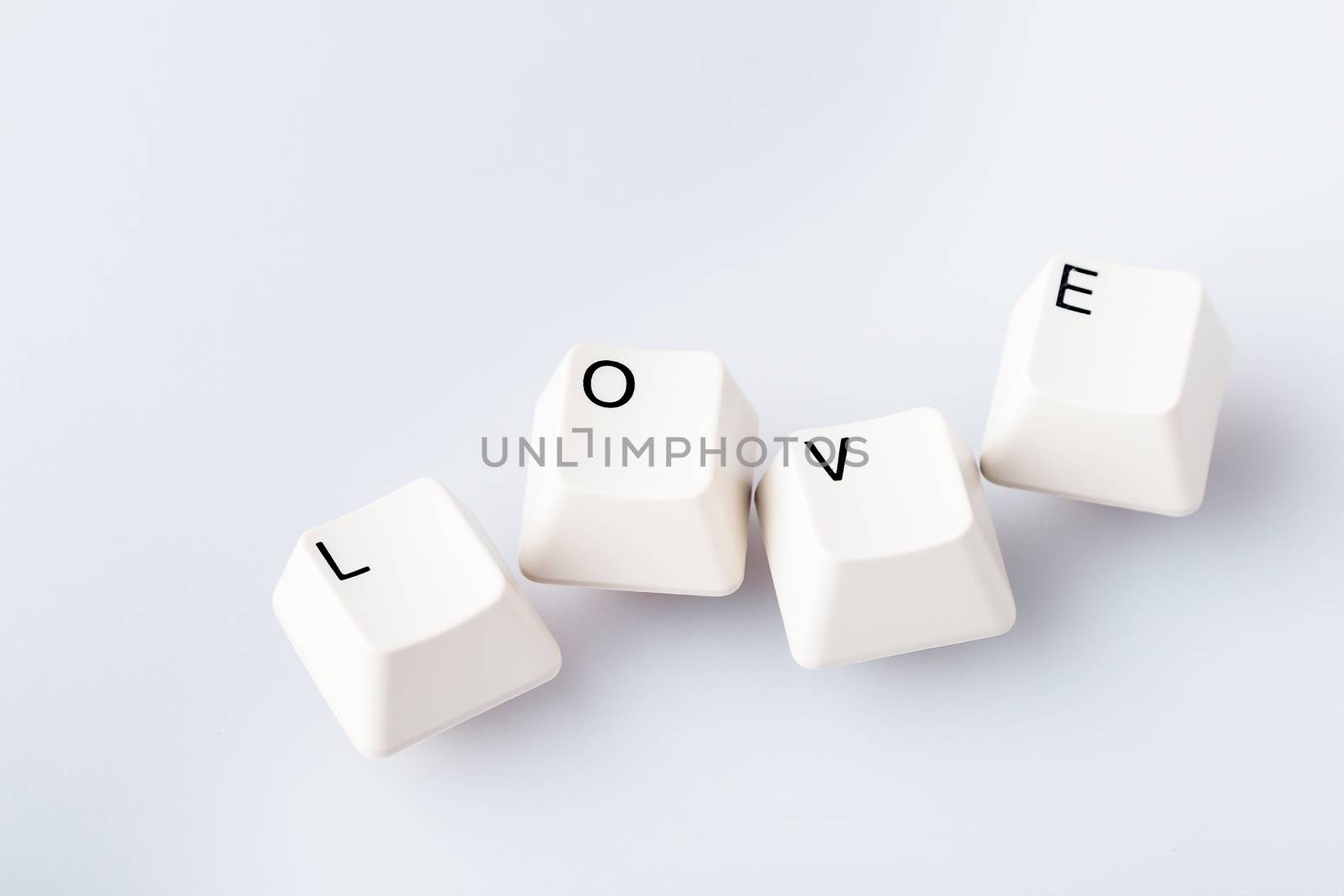 Word LOVE on computer keyboard's buttons. May be used as symbol of love on the Internet, love e-mail letters.