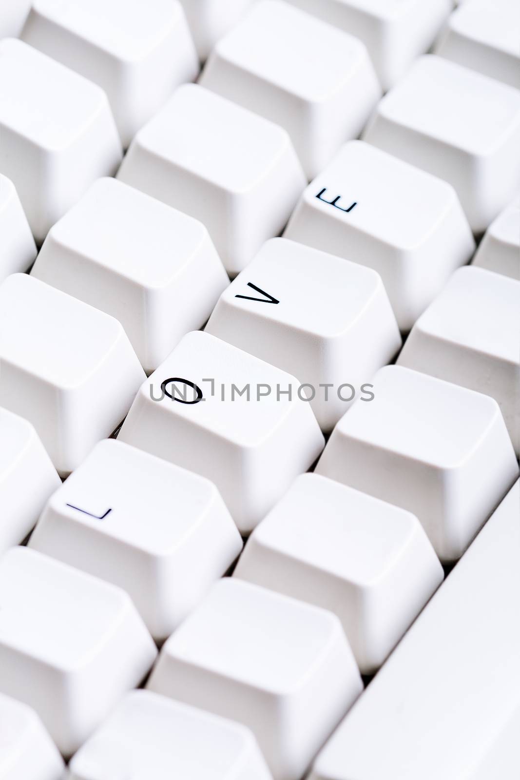 Word LOVE on computer keyboard with empty space on other buttons. May be used as symbol of love on the Internet, love e-mail letters.