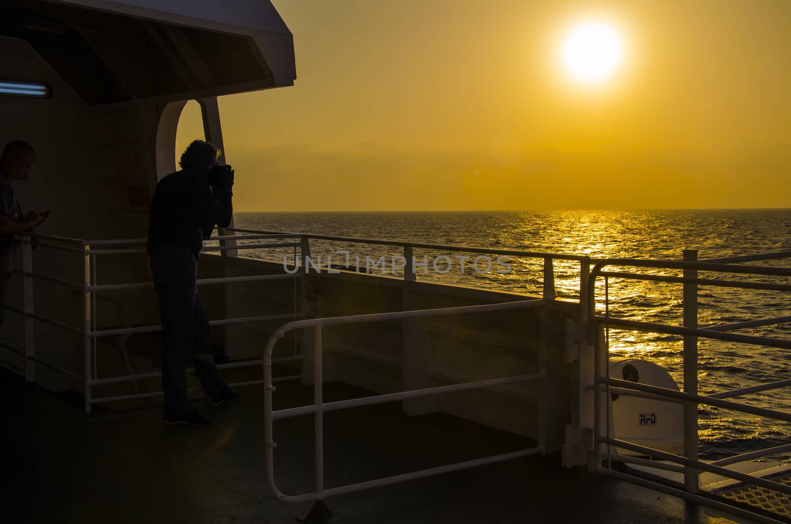 Sunset in the aegean sea from a boat. by MAEKFOTO
