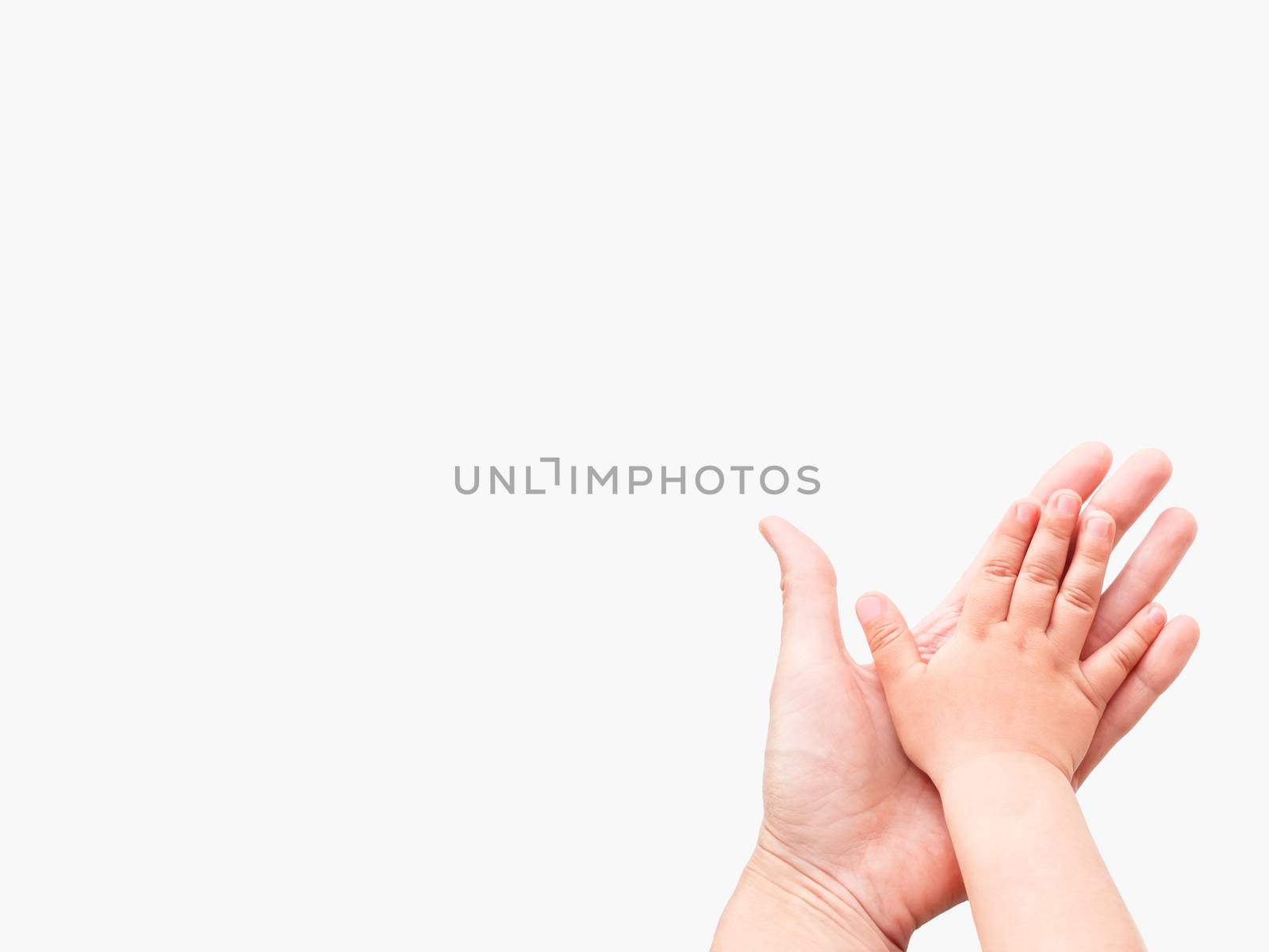 Hands of adult and child. Mother and kid put their palms together on white background. Parent and toddler. Symbol of family, unanimity, support.