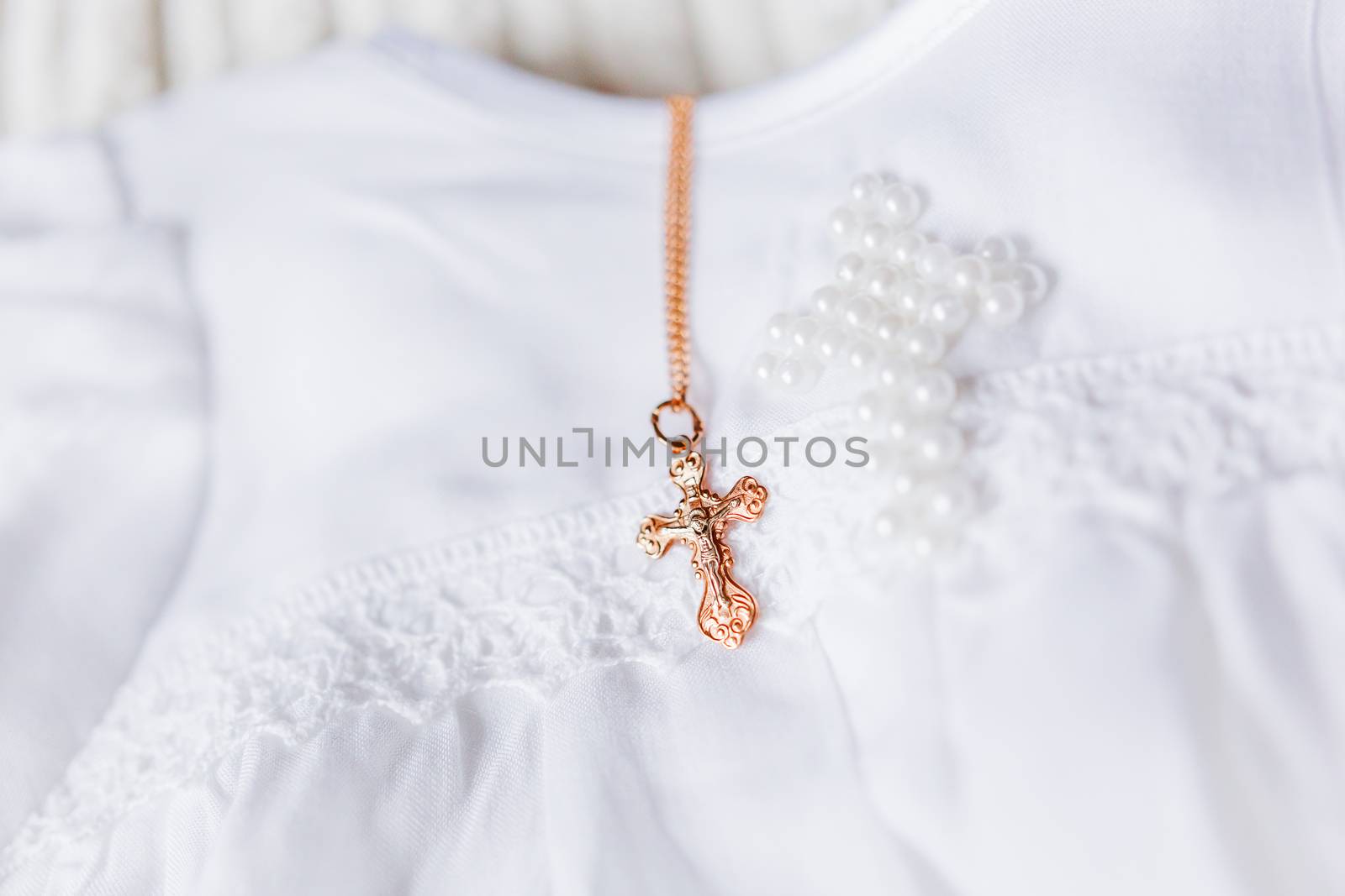 Laced dress for christening. Elegant outfit for little baby. Russian Orthodox church ceremony details.