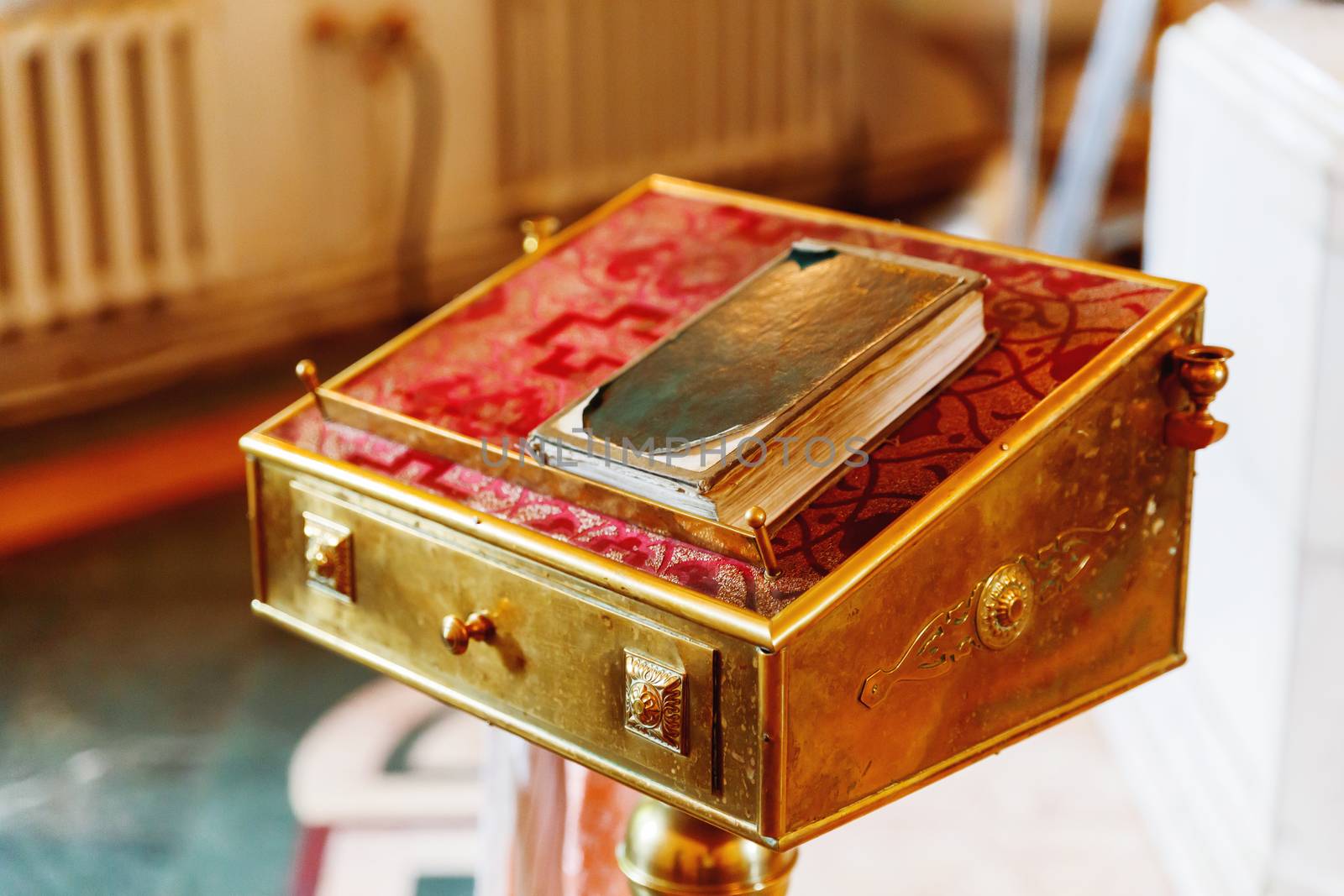 Religious utensils - shabby old Bible. Details in orthodox christian church. Russia.