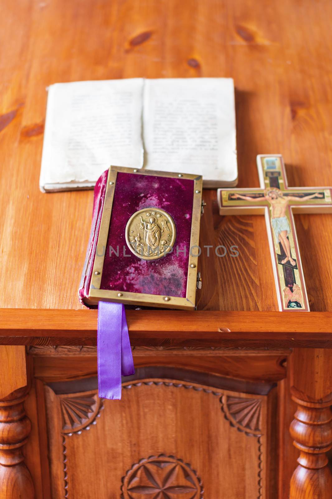 Religious utensils - bible, cross, prayer book. Details in orthodox christian church. Russia.