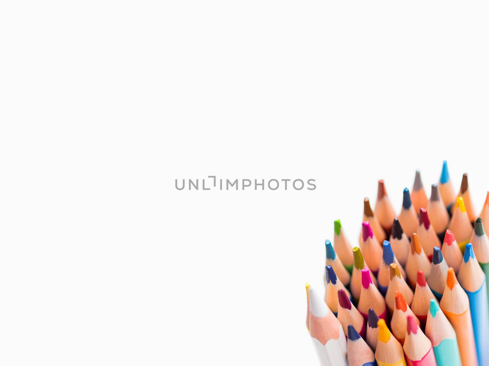 Bunch of colorful watercolor pencils on white background. School supplies. Kid's stationery with copy space. Back to school backdrop.
