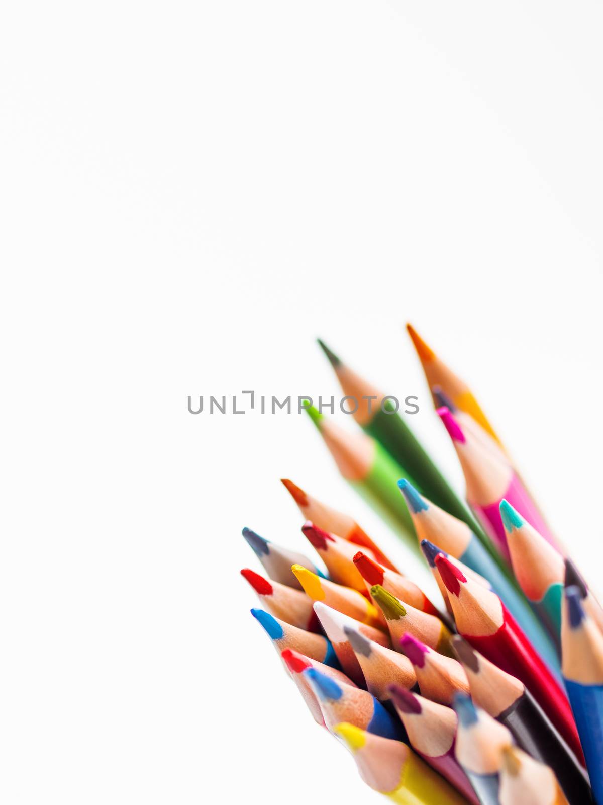 Bunch of colorful watercolor pencils on white background. School supplies. Kid's stationery with copy space. Back to school backdrop.