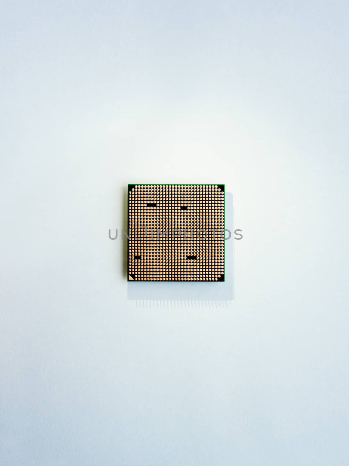 Central computer processor. CPU on light blue background. Technological detail of personal computer. Top view, flat lay.