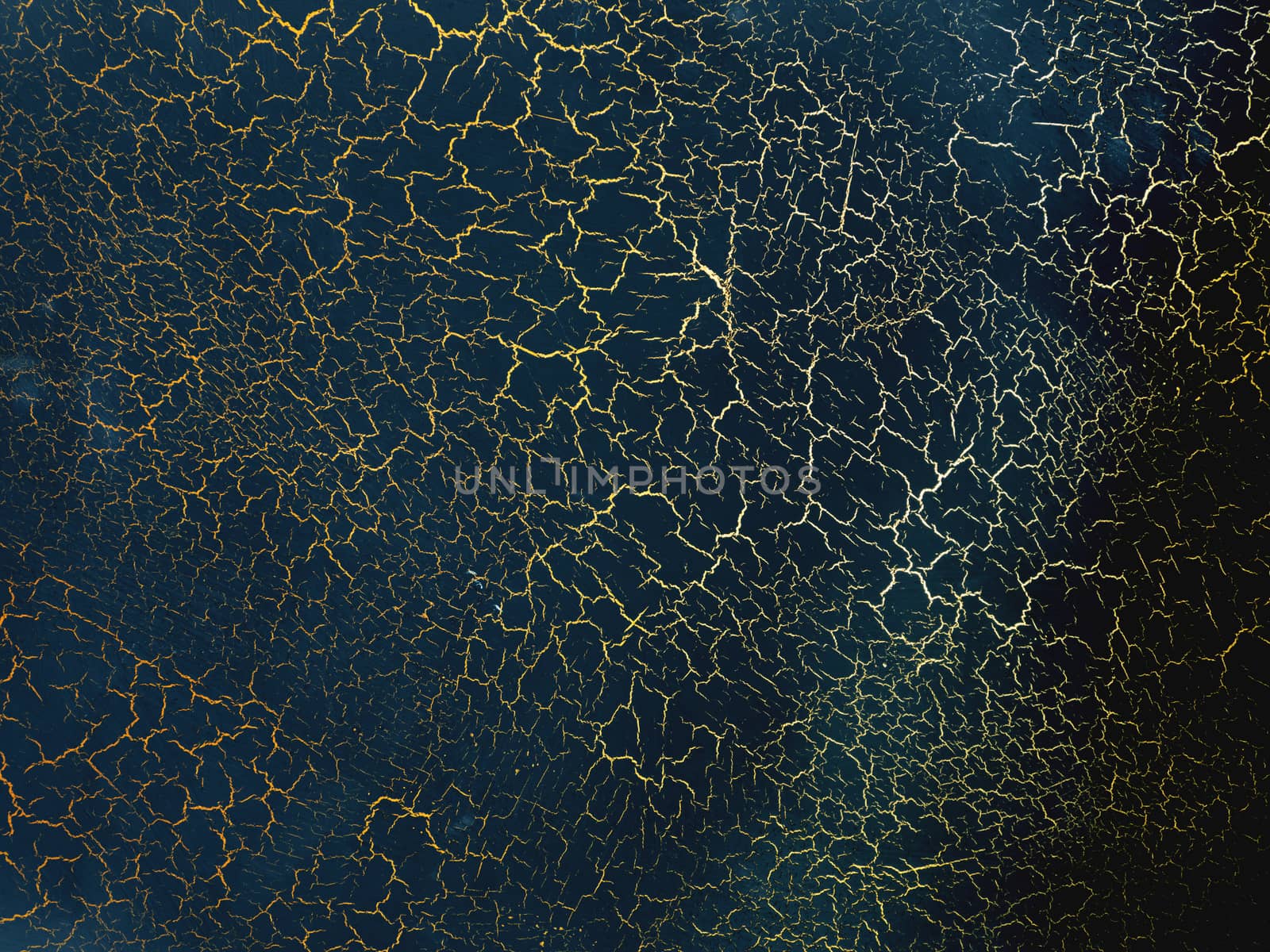 Dark blue texture with gold cracks. Surface with craquelure effect.