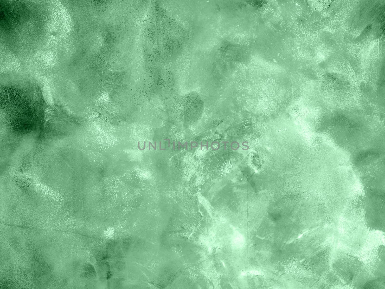 Concrete texture of neo mint colored wall with chaotic circular marks building tool. Decorative traces of the trowel to the wall. Fashionable interior decoration.