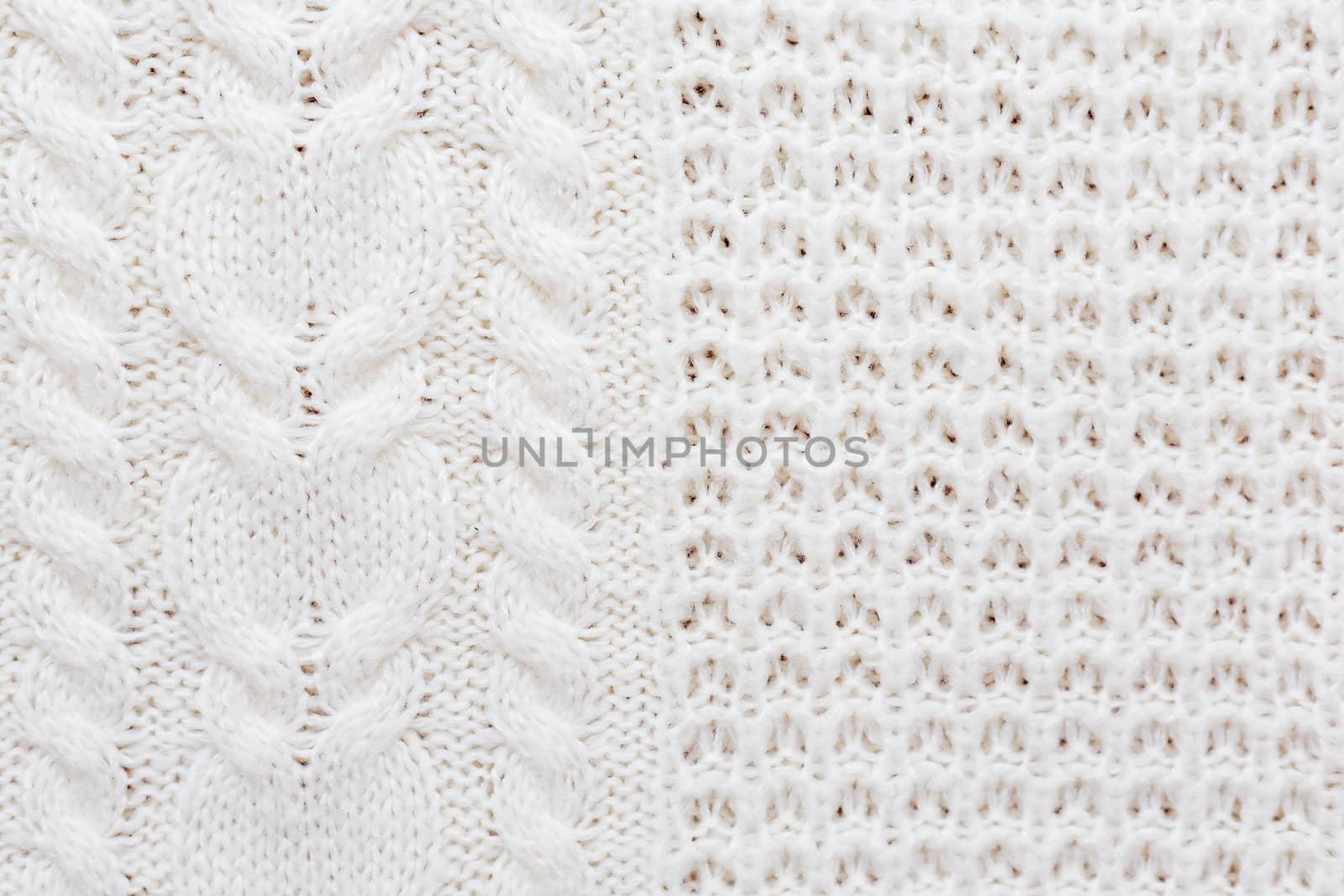 Abstract knitted background. Wool white sweater texture. Close up picture of knitted pattern.