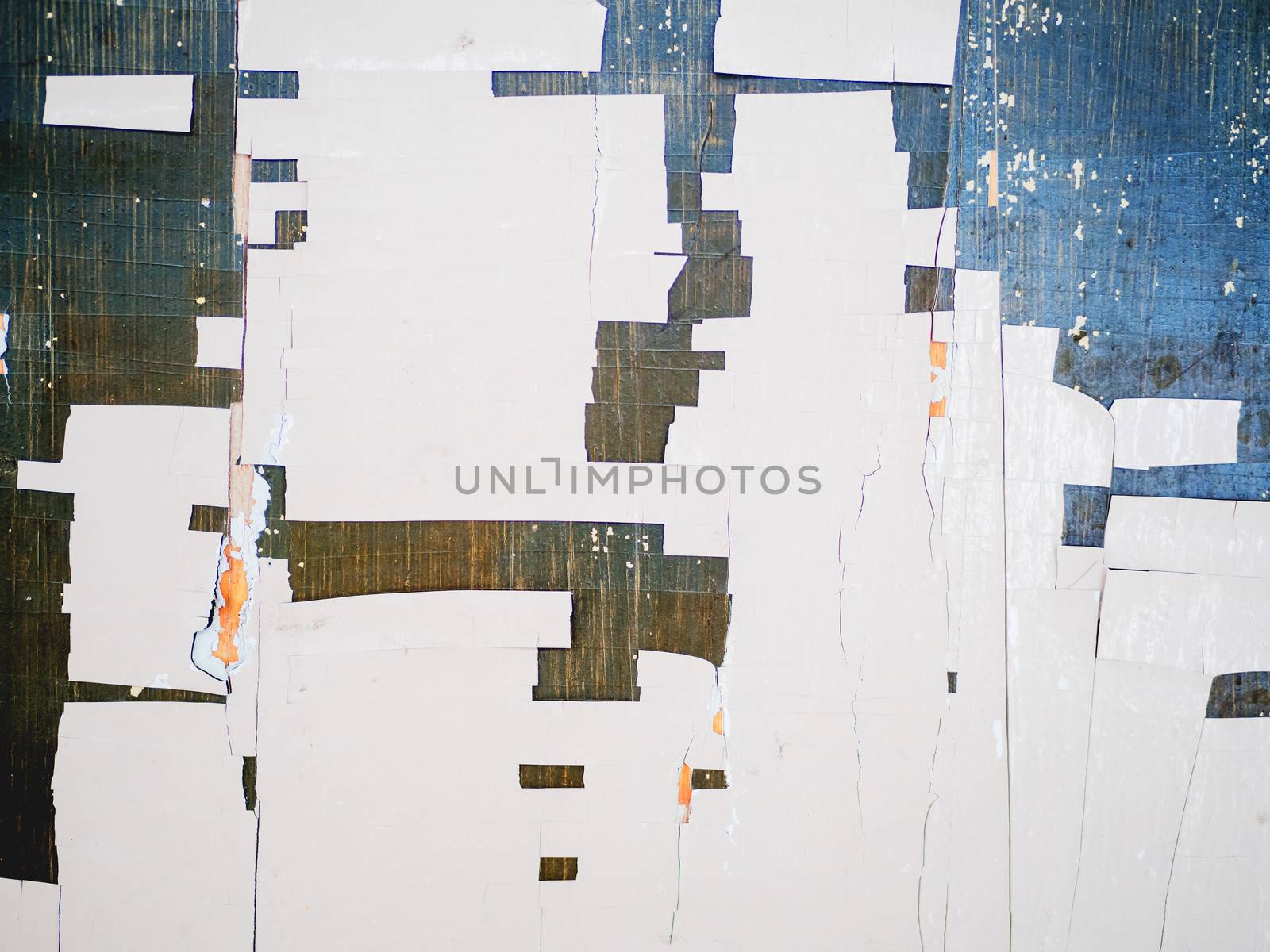 Wooden background of old fence with rusty nails. Shabby texture of white colored wooden boards.