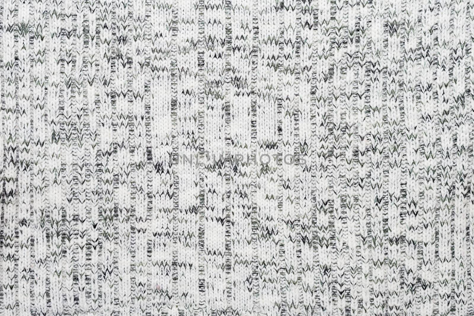 Abstract knitted background. Wool sweater texture. Close up picture of knitted pattern.