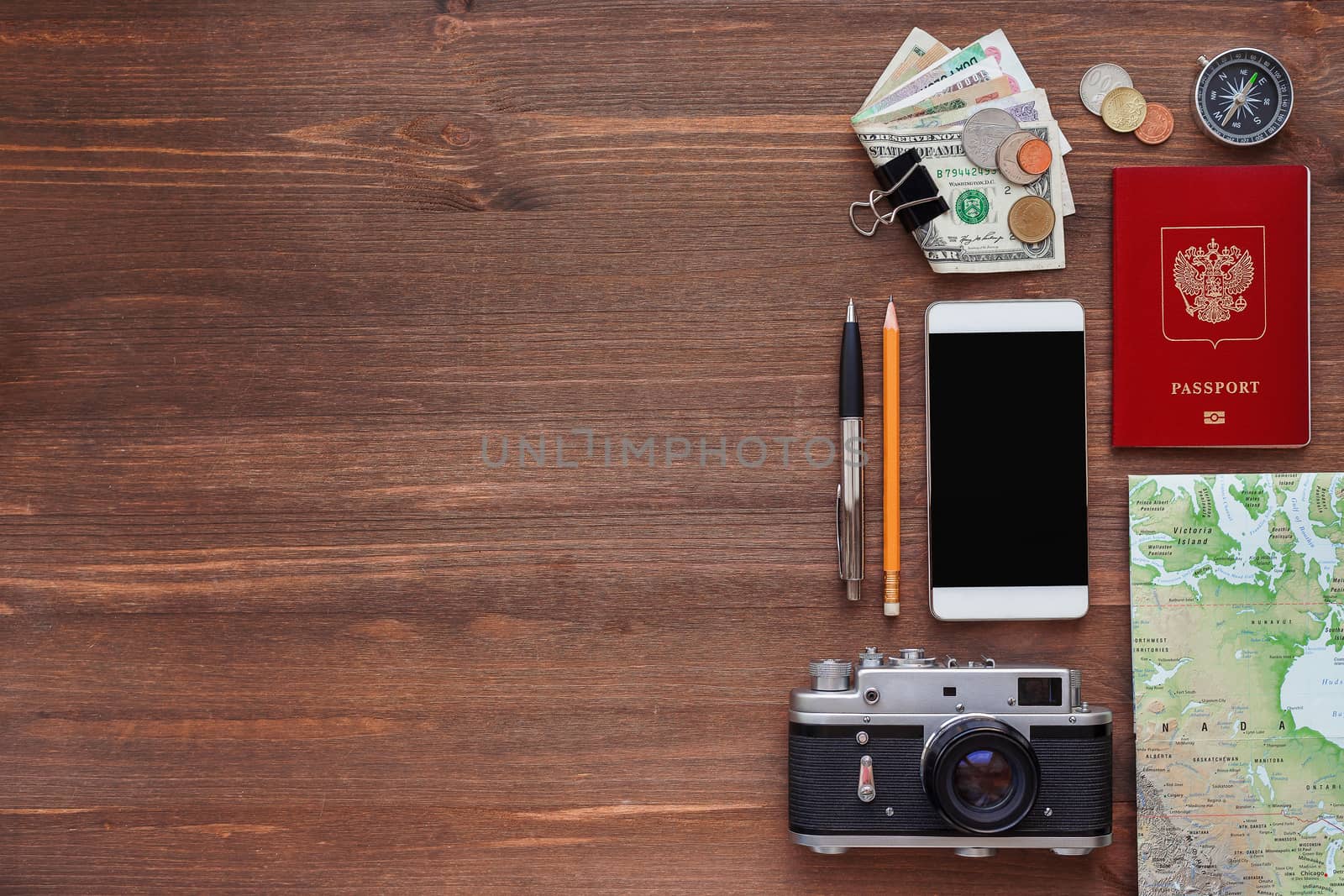 Travel background. Different things you need for journey - smartphone, passport, camera, map, money. Place for text.