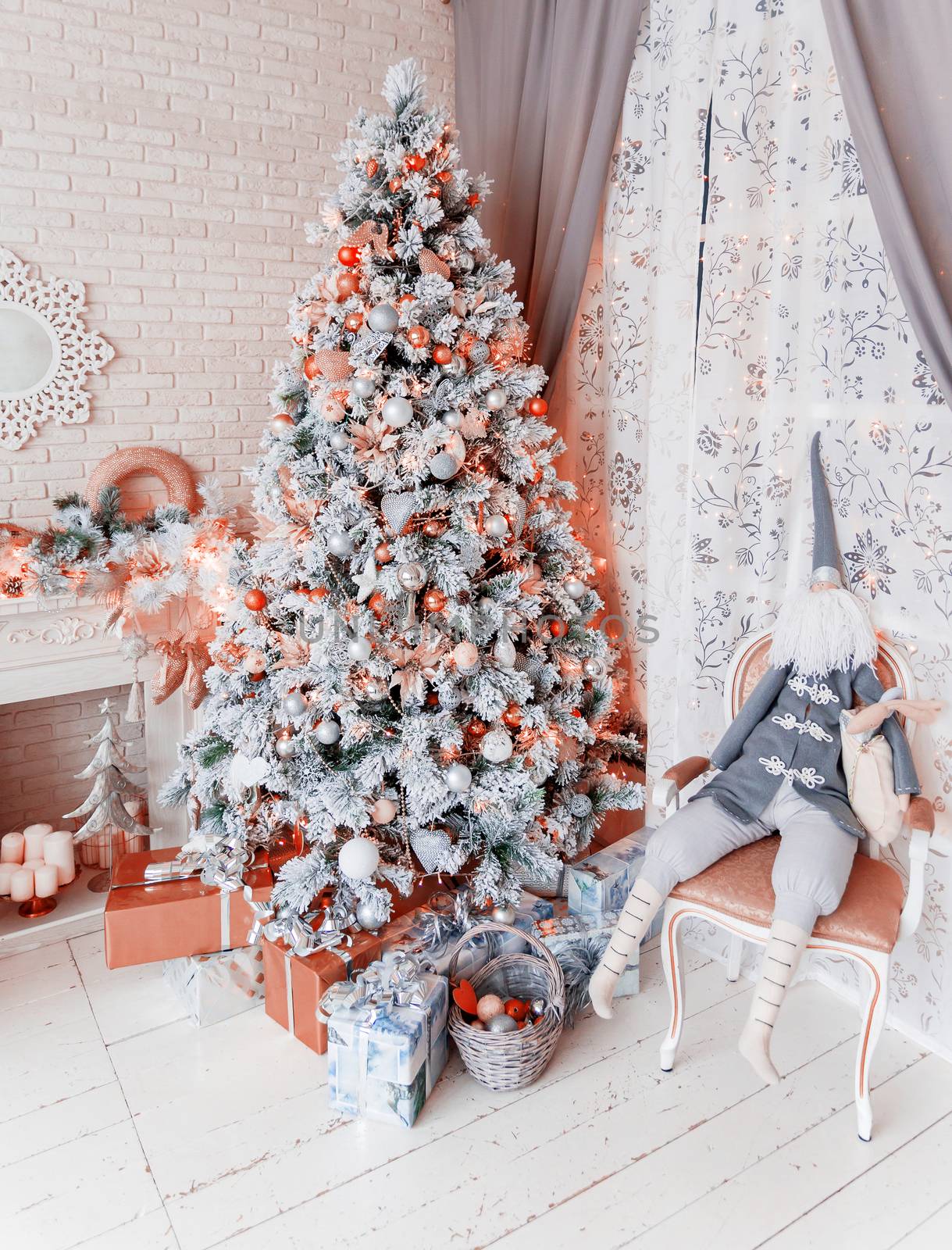 Christmas and New Year Eve Tree. Holiday winter background. Interior details - mirror-snowflake, mantelpiece with garland of light bulbs, many presents and elf with gifts.
