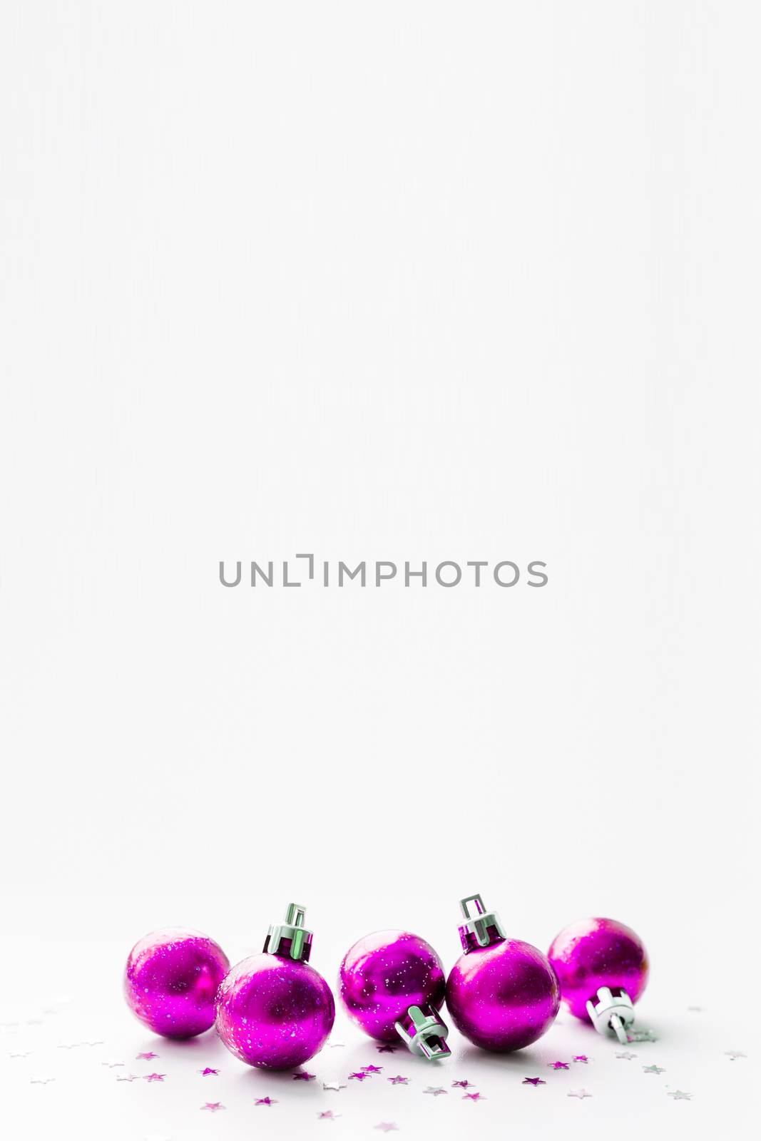 Christmas and New Year background with magenta purple decorative balls for Christmas tree. Place for text.