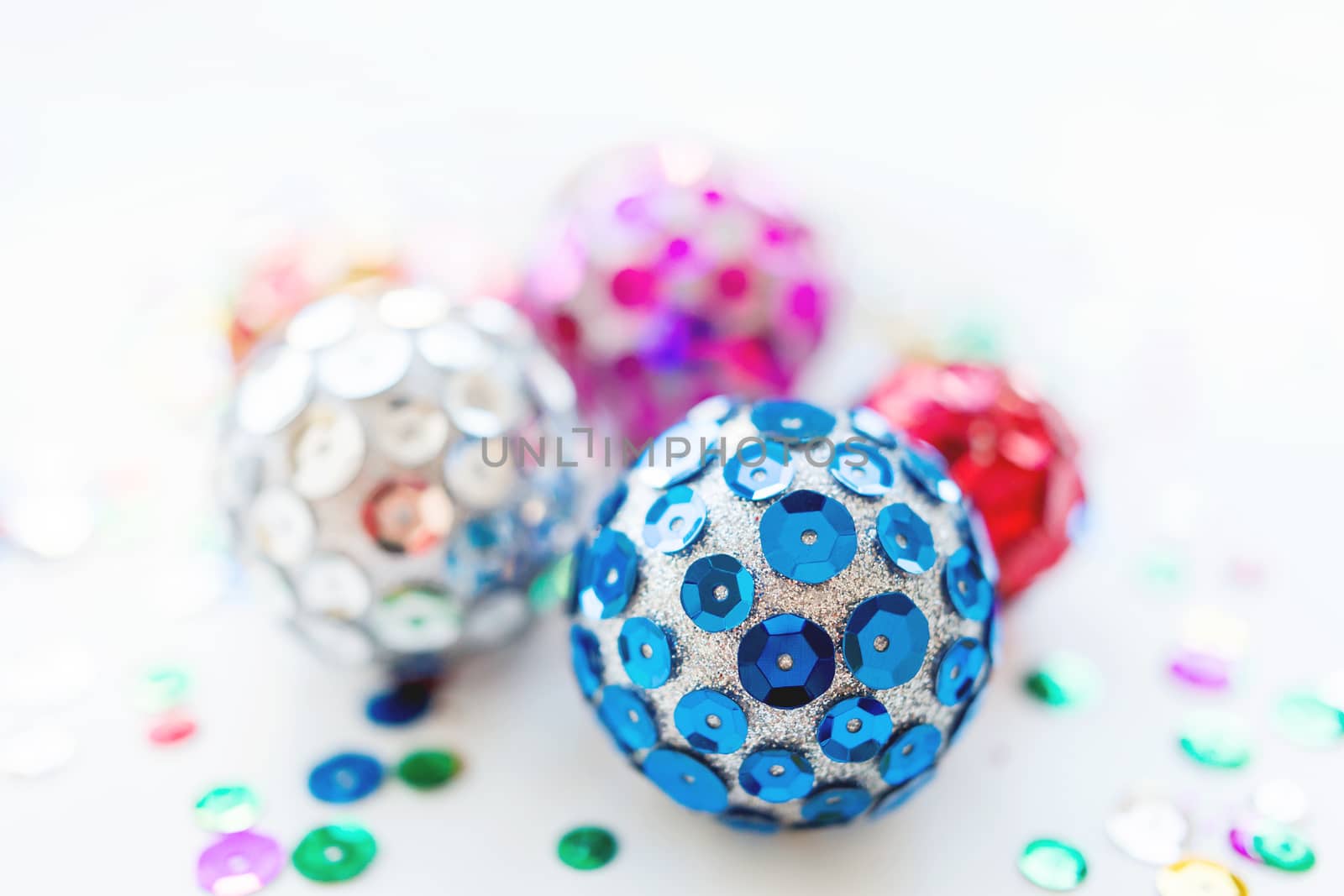 Christmas and New Year background with decorations - bright balls, hand made with colorful sparkling spangles.