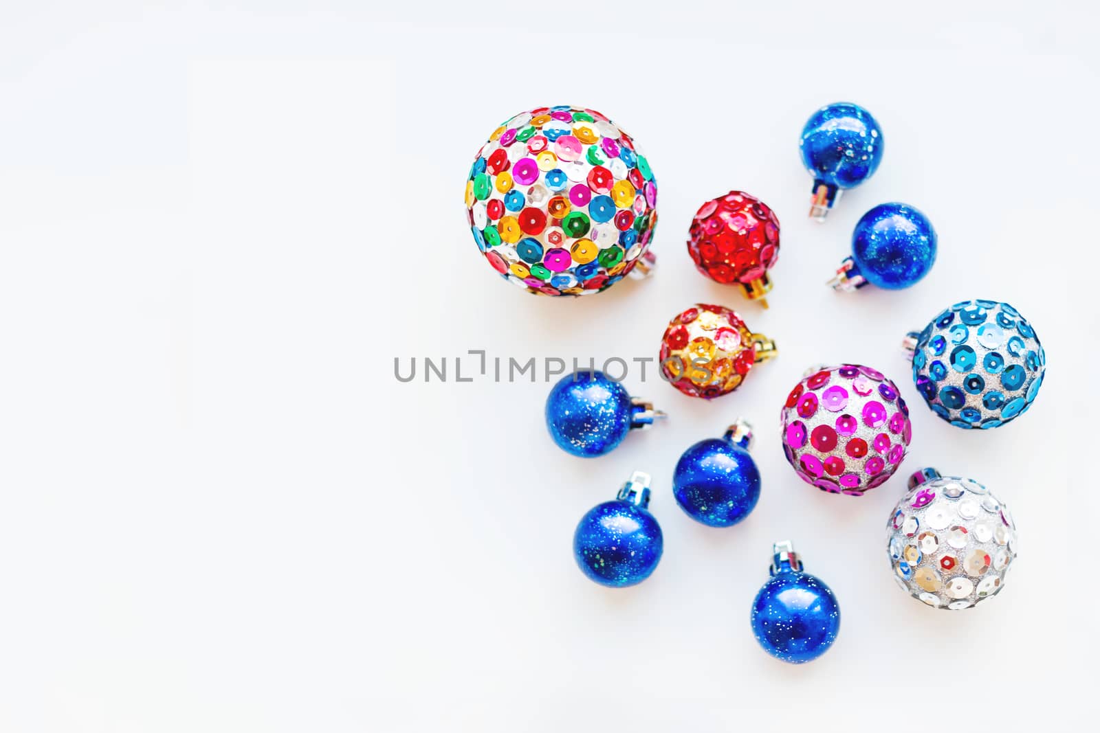 Christmas and New Year background with decorations - bright balls, hand made with colorful sparkling spangles. Place for text.