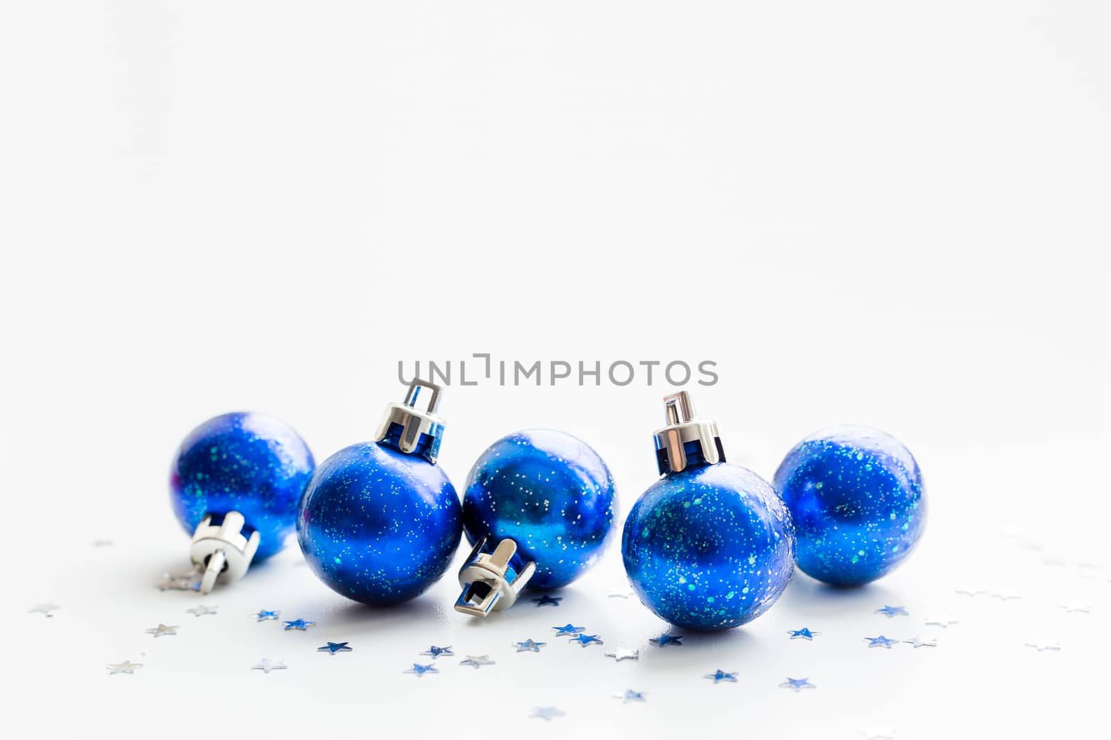 Christmas and New Year background with blue starry decorative balls for Christmas tree. Place for text.