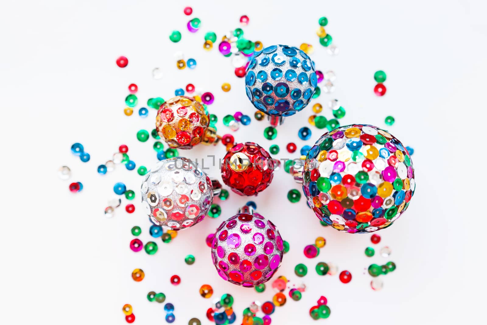 Christmas and New Year background with decorations - bright balls, hand made with colorful sparkling spangles.