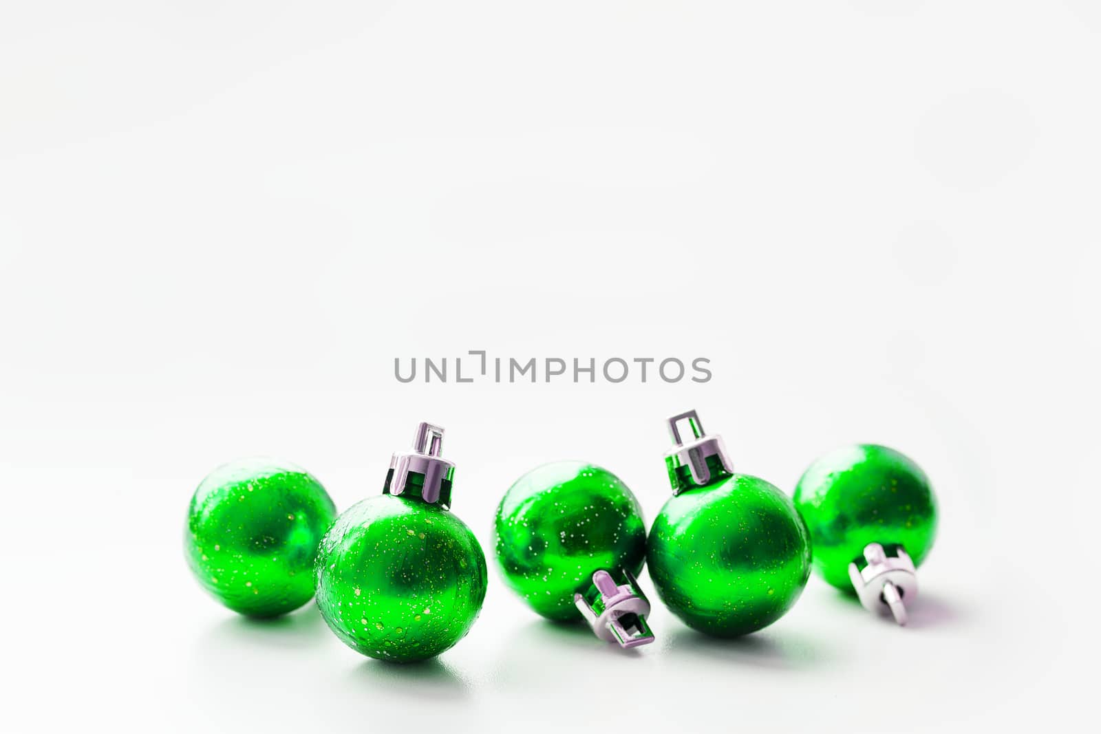Christmas and New Year background with green decorative balls for Christmas tree. Place for text.