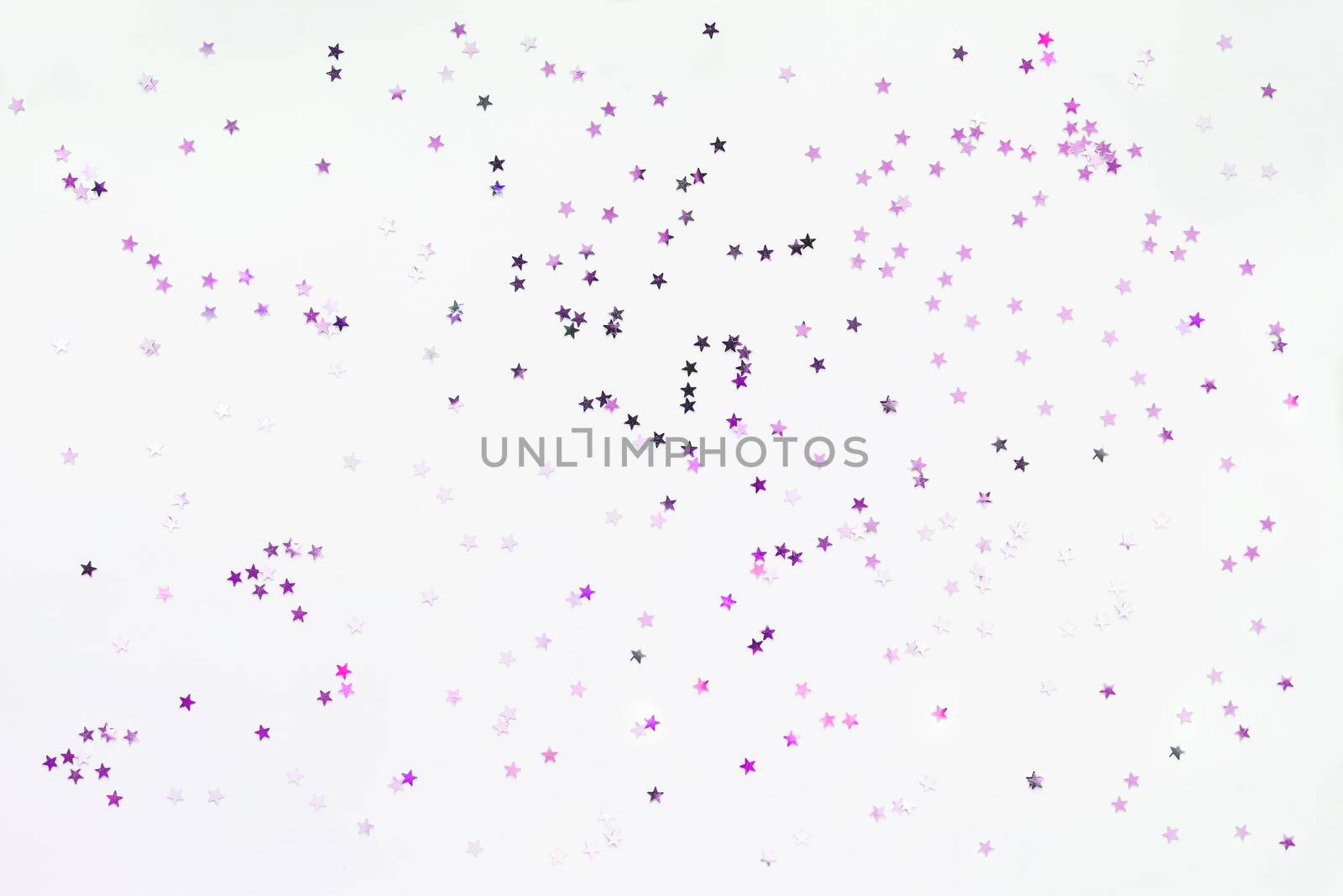 Holiday background with silver and violet star confetti. Good background for Christmas and New Year cards.