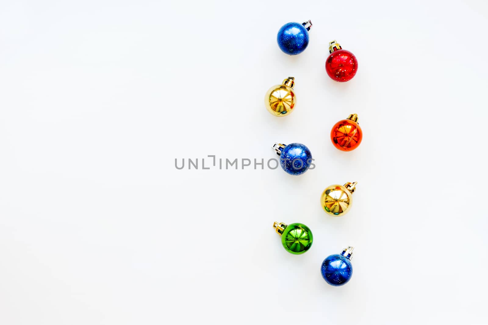 Christmas and New Year background with shiny colorful balls. Flay lay, top view. Place for text.
