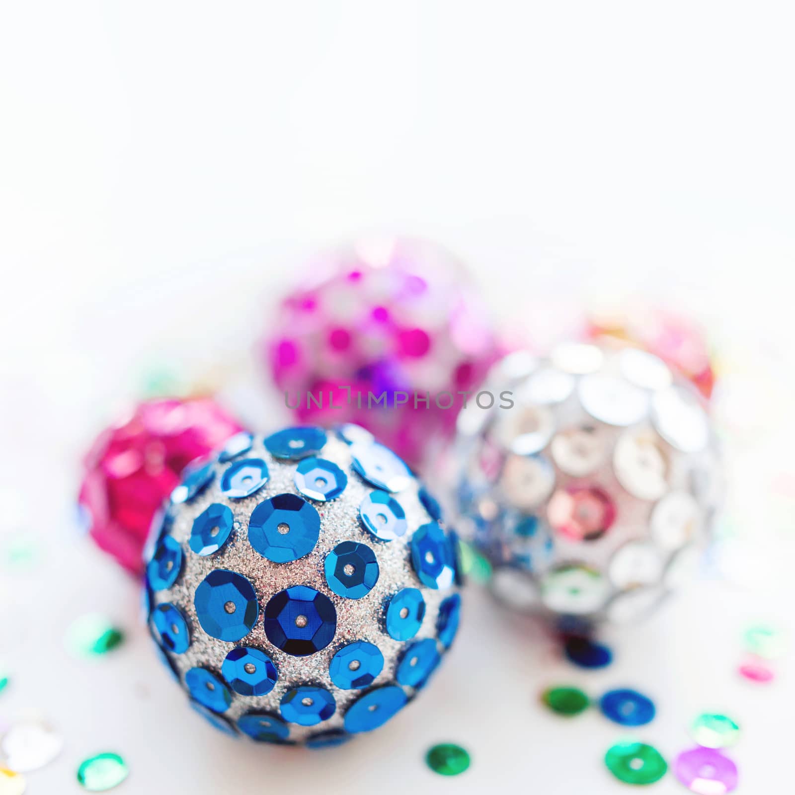 Christmas and New Year background with bright balls. Hand made decorations for Christmas tree with colorful sparkling spangles. Place for text.