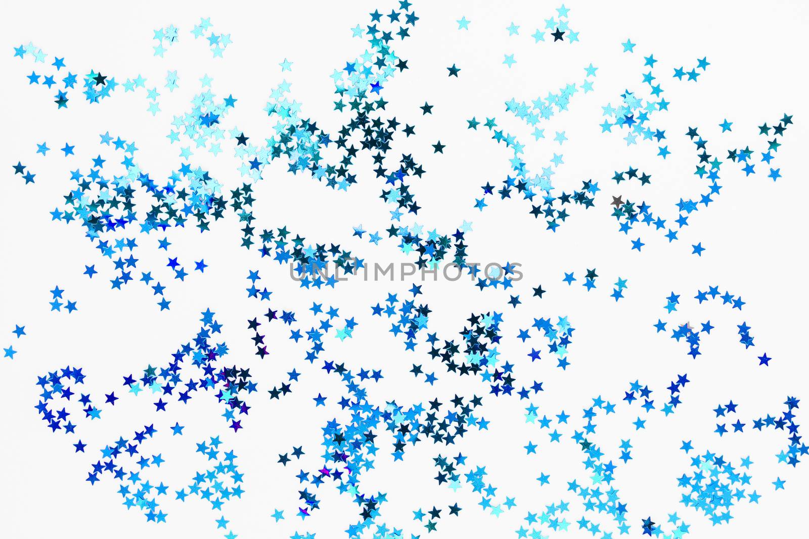 Holiday background with blue star confetti. Good background for Christmas and New Year cards.