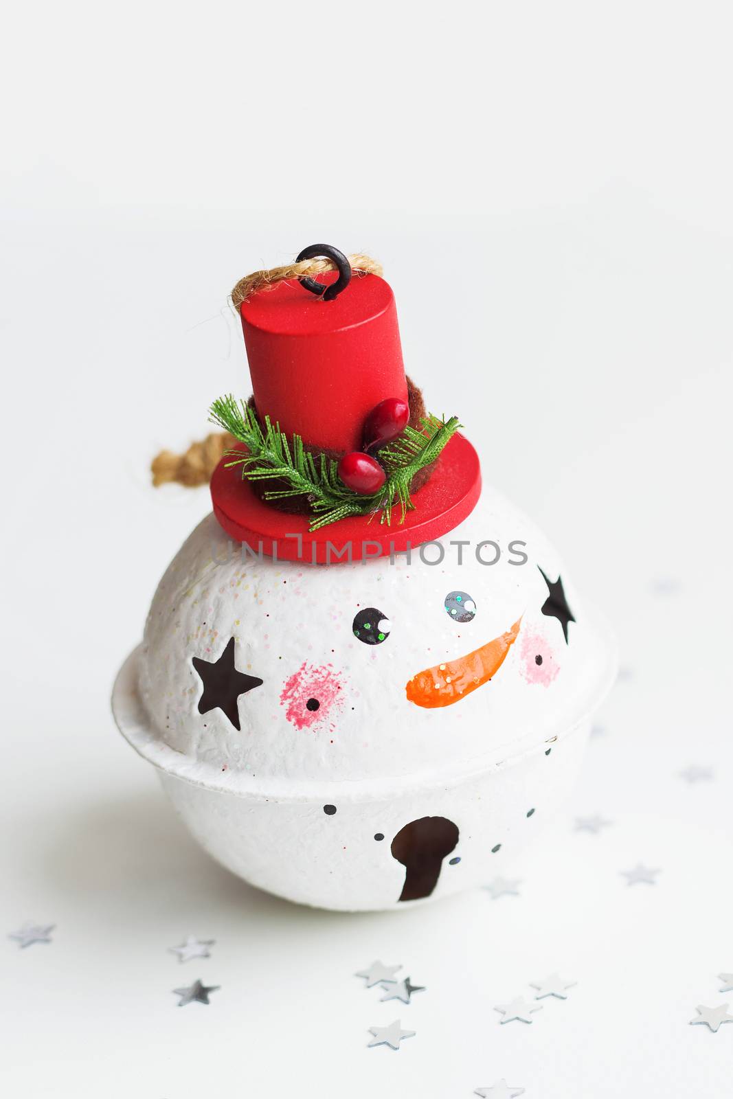 Christmas and New Year background with Snowman decorative ball for Christmas tree. Holiday background with stars confetti.
