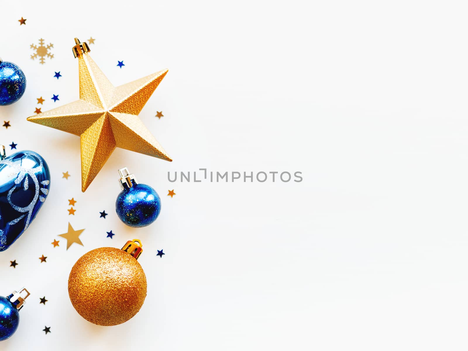Christmas and New Year 2020 background with decorations, shaped as a circle. Golden and blue balls, stars, confetti and heart.
