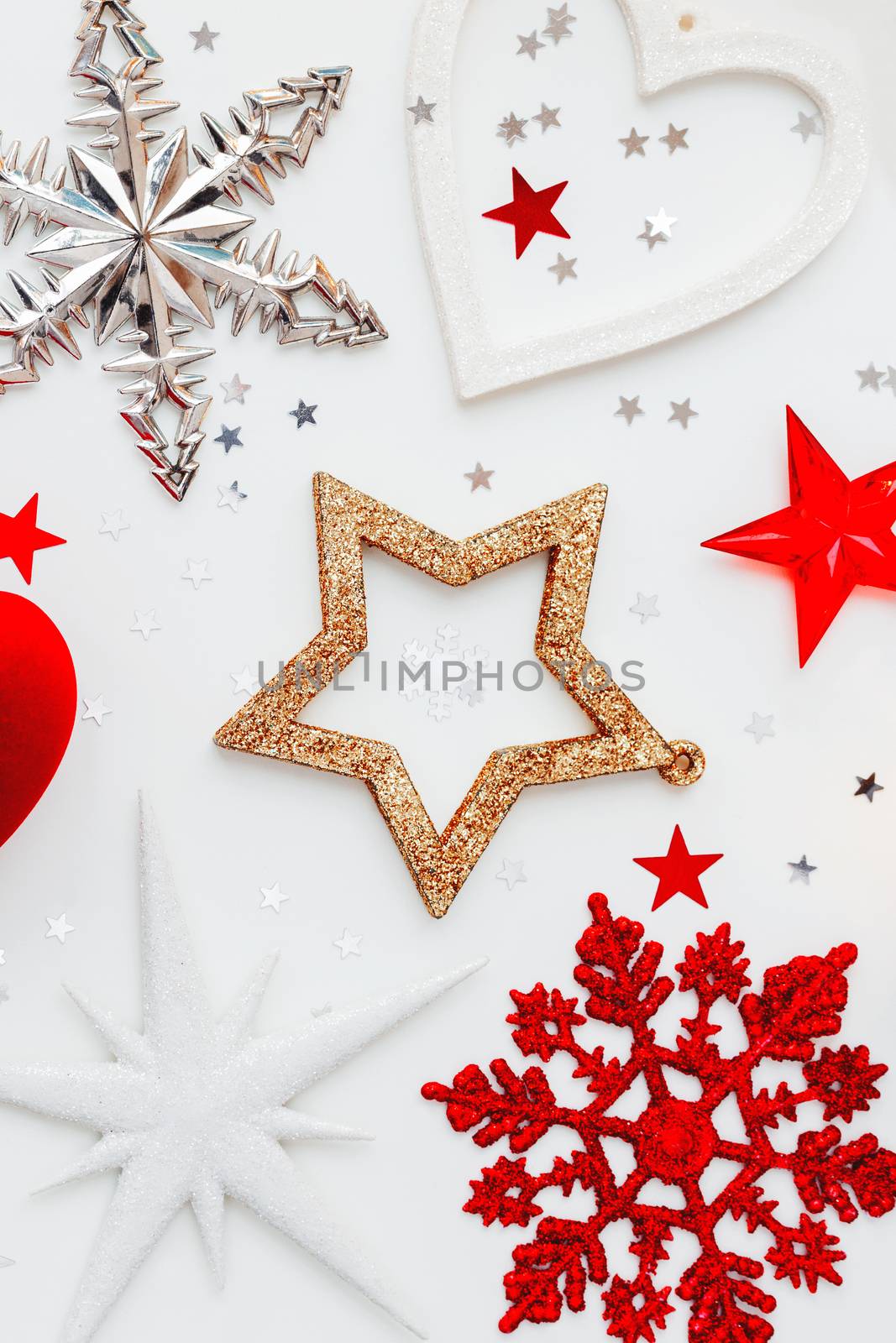 Christmas and New Year holiday background with decorations and red gift heart box. Top view, flat lay.
