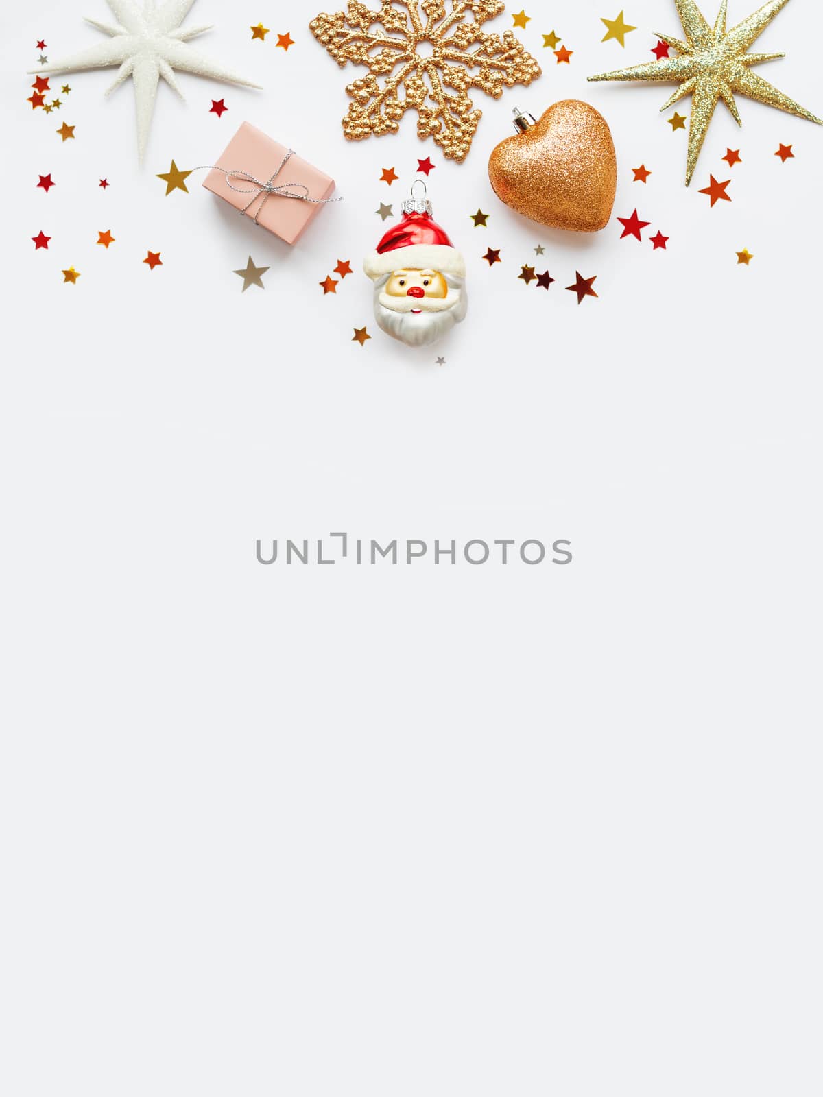 Christmas and New Year background with sparkling fir tree, Santa Claus, heart, snowflakes and star confetti. Holiday decorations on white background.
