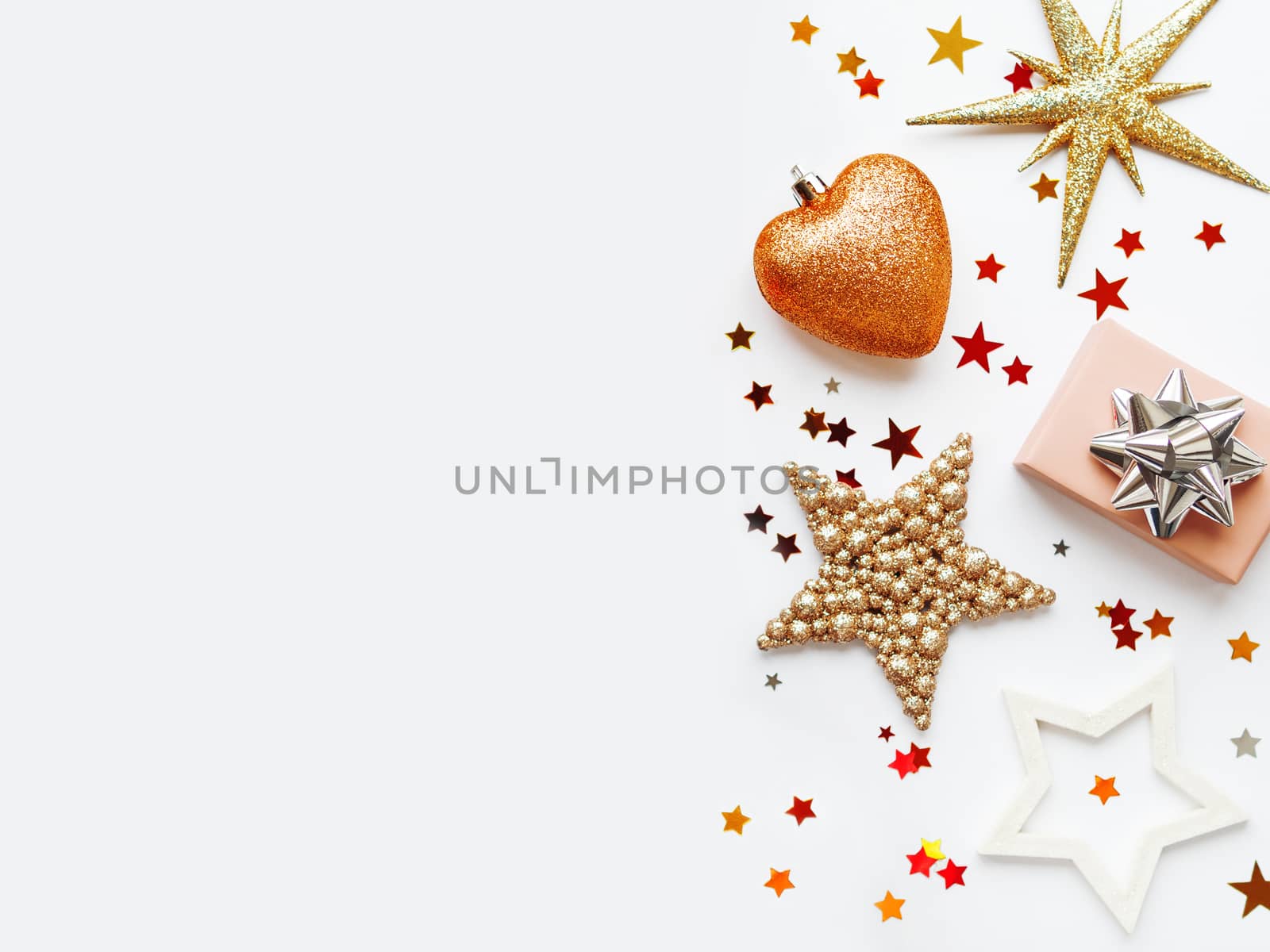 Christmas and New Year background with sparkling fir tree, Santa Claus, heart, snowflakes and star confetti. Holiday decorations on white background.