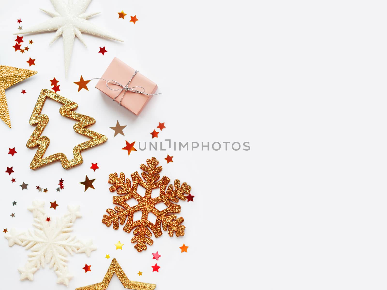Christmas and New Year background with sparkling fir tree, snowflakes and star confetti. Holiday decorations on white background.