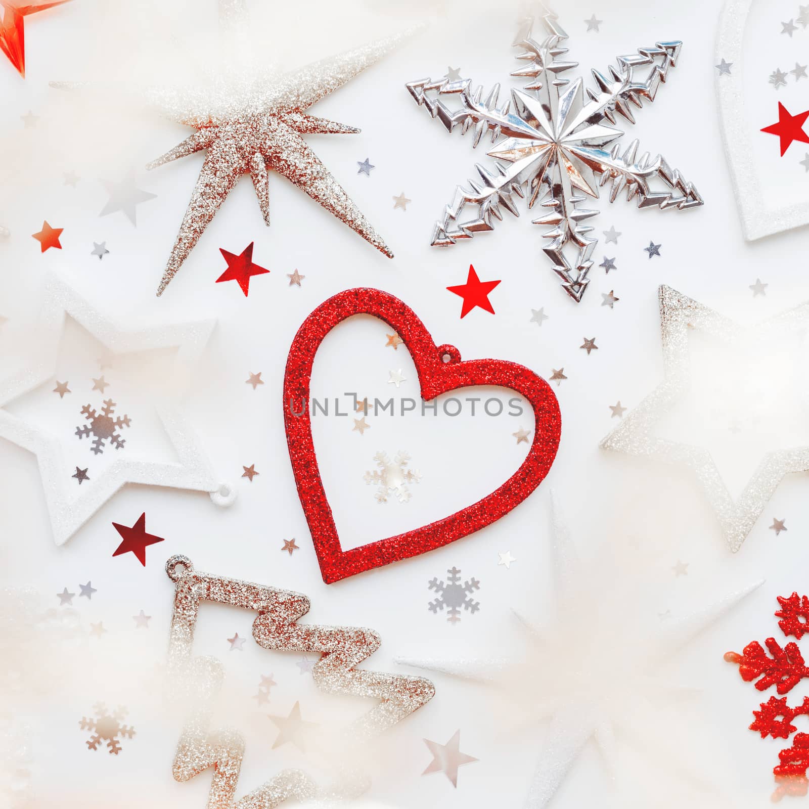 Christmas and New Year background with sparkling fir tree, heart, snowflakes and star confetti. Holiday symbols on white background with light bulbs.