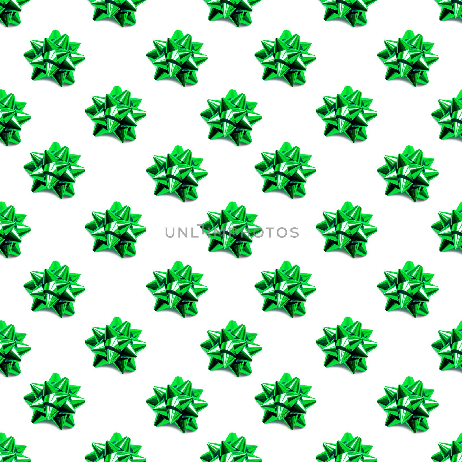 Seamless pattern with sparkling green bow. Holidaybackground with decorative bows.