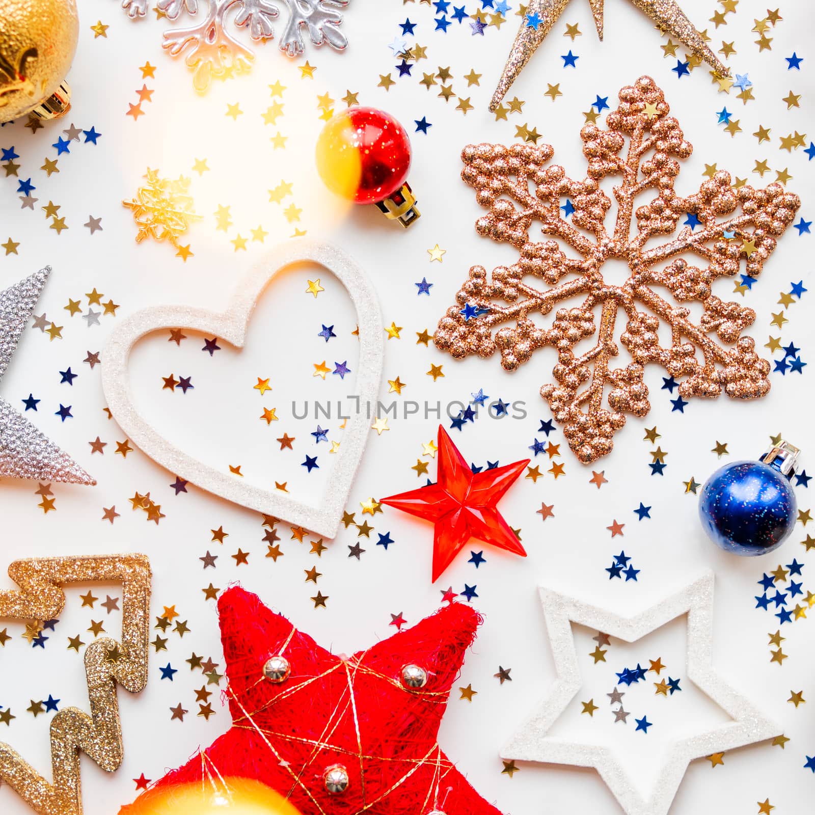 Christmas and New Year background with decorations - shiny stars, balls, snowflakes, light bulbs and confetti. by aksenovko